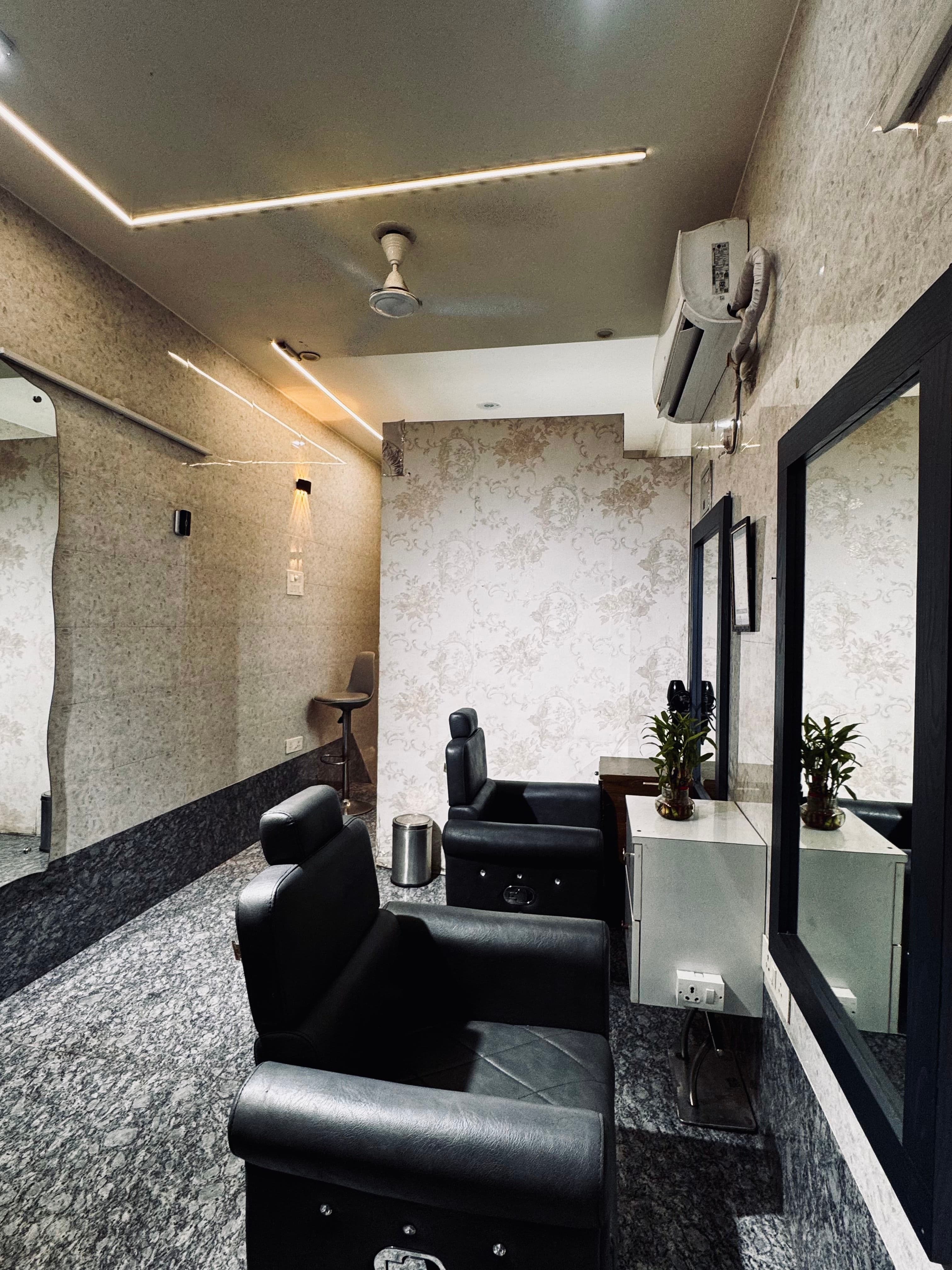 Hair-styling chairs and mirrors inside Shiva Hair Studio.